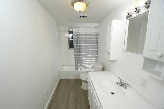 full bathroom with toilet, vanity, shower / bathtub combination with curtain, and hardwood / wood-style floors