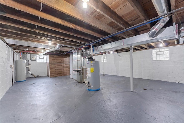 basement with plenty of natural light and water heater