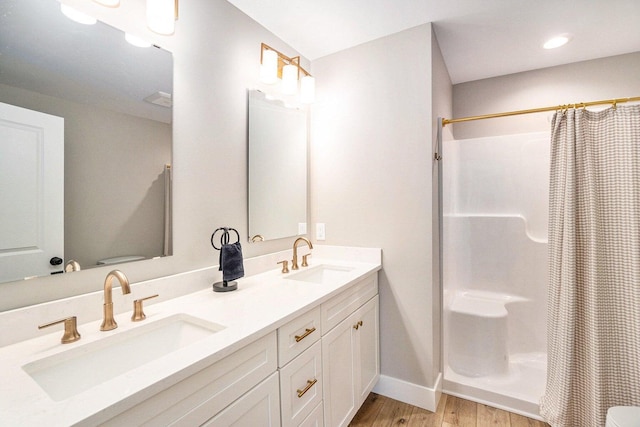 108 Elkenburg St Unit 18, South Haven, MI 49090 - bathroom featuring hardwood / wood-style floors, toilet, vanity, and a shower with shower curtain