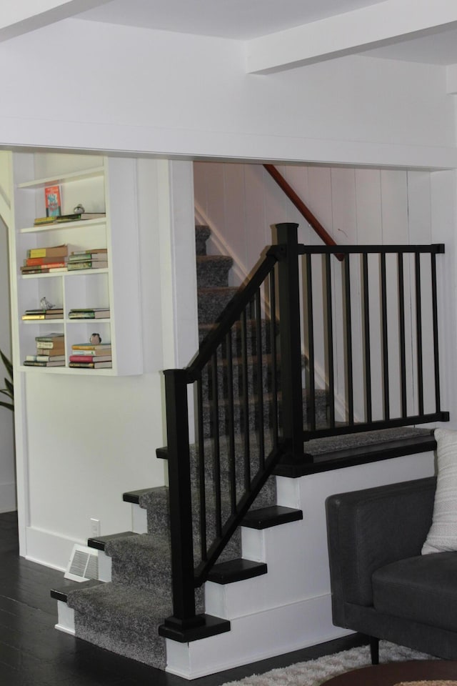 stairs with wood-type flooring