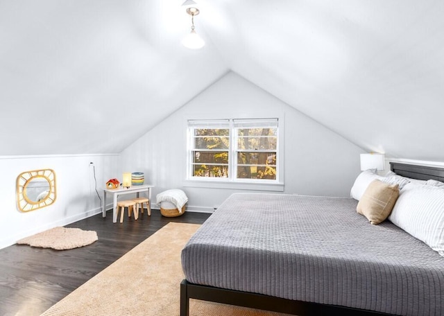 bedroom featuring dark hardwood / wood-style flooring and vaulted ceiling