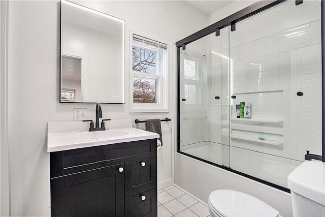 full bathroom with vanity, toilet, tile patterned floors, and shower / bath combination with glass door