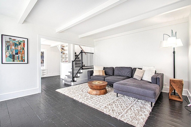 living room featuring beam ceiling