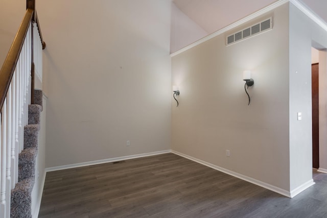 spare room with dark hardwood / wood-style floors