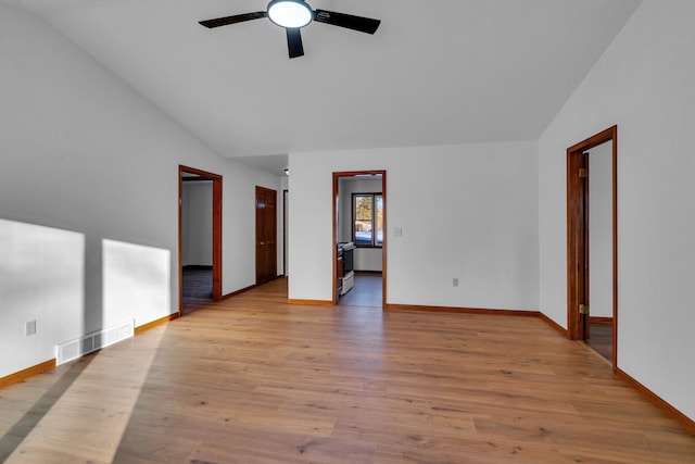 unfurnished room with ceiling fan, lofted ceiling, and light wood-type flooring