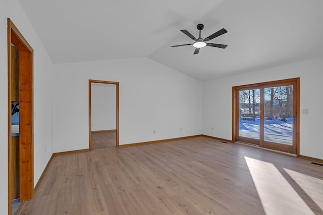 spare room with lofted ceiling, ceiling fan, and light hardwood / wood-style flooring