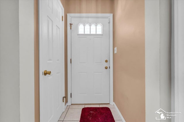 doorway with light tile patterned floors