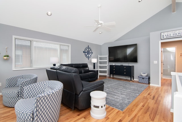 living room featuring lofted ceiling, hardwood / wood-style floors, and ceiling fan