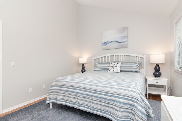 bedroom with hardwood / wood-style floors