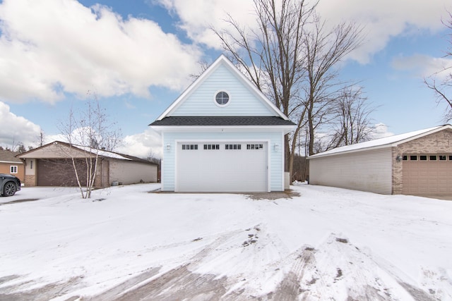 view of snow covered garage