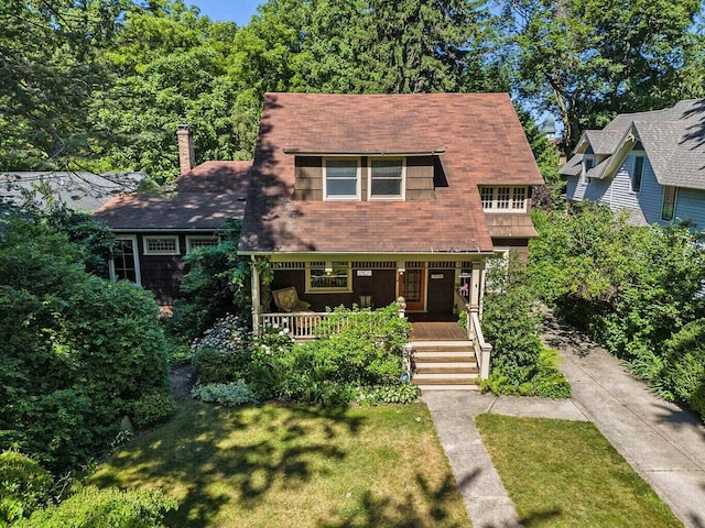 view of front of house featuring a front lawn and a porch