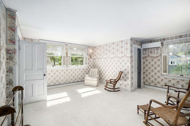 living area with an AC wall unit, a baseboard radiator, and light carpet