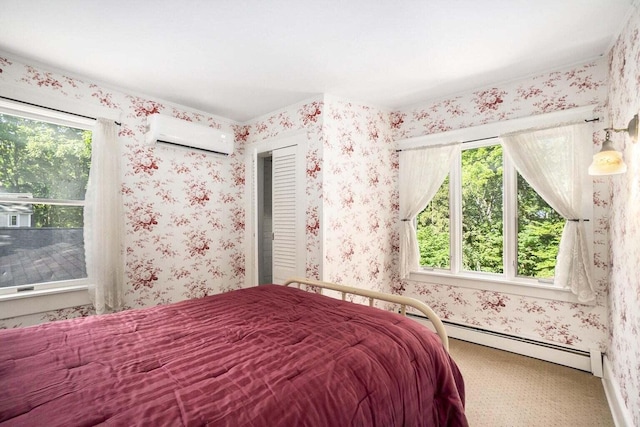 carpeted bedroom featuring an AC wall unit and a baseboard heating unit