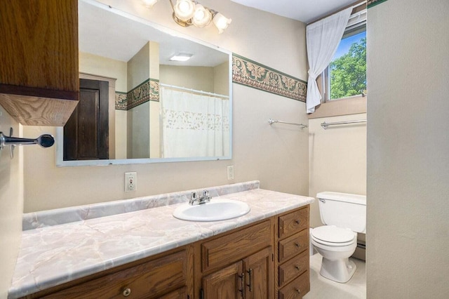 bathroom with vanity and toilet