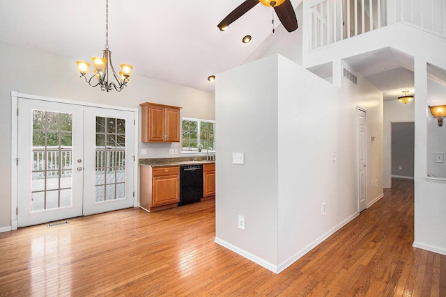 kitchen featuring french doors, a wealth of natural light, black dishwasher, and a high ceiling