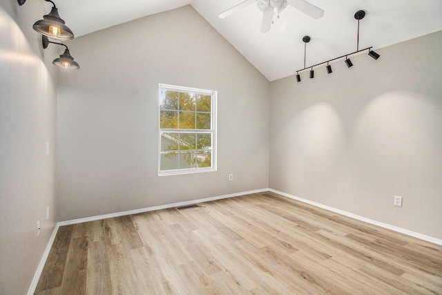 unfurnished room with ceiling fan, high vaulted ceiling, and light hardwood / wood-style floors