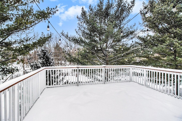 view of snow covered deck