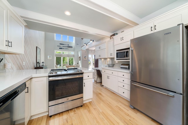 kitchen featuring decorative backsplash, white cabinetry, appliances with stainless steel finishes, and beamed ceiling