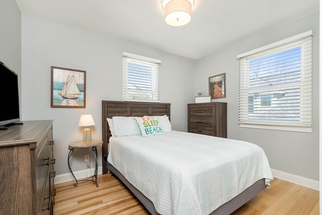 bedroom with light hardwood / wood-style flooring