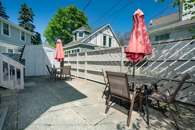 view of patio / terrace featuring a storage unit