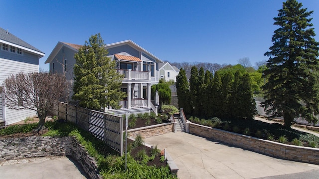 view of front of house featuring a balcony