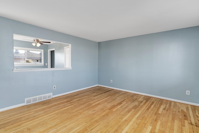 spare room with light hardwood / wood-style floors and ceiling fan