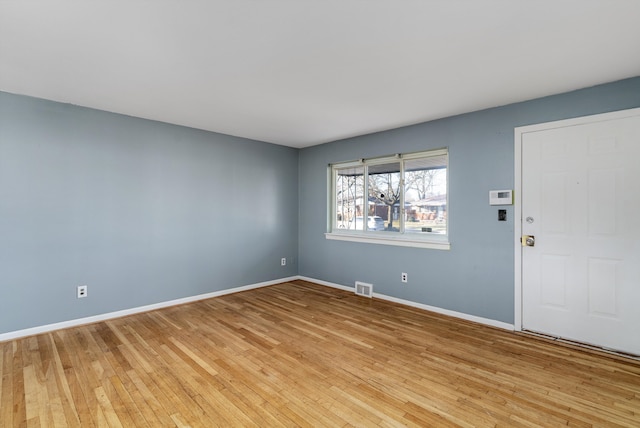 unfurnished room featuring light hardwood / wood-style flooring