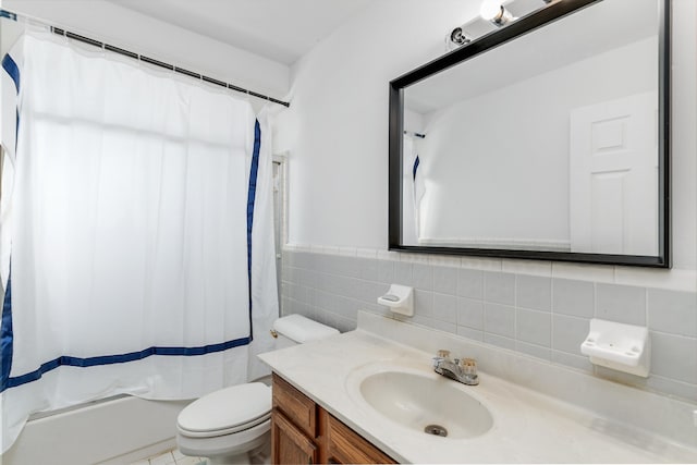 full bathroom with vanity, toilet, and shower / tub combo with curtain