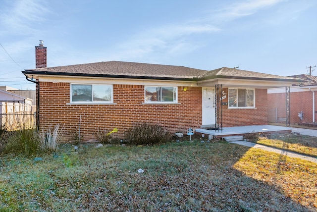 bungalow-style house with a patio area and a front yard