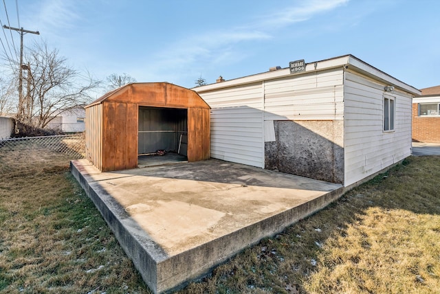 view of outdoor structure featuring a lawn