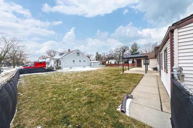 view of yard with a patio area, fence, and a gazebo