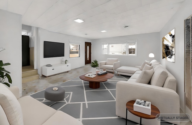 living room featuring concrete flooring