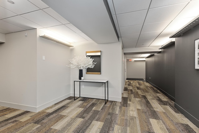 hallway featuring a paneled ceiling