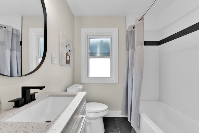 full bathroom featuring vanity, shower / tub combo, tile patterned floors, and toilet