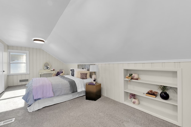 bedroom with lofted ceiling and carpet flooring