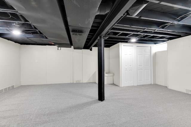 basement featuring carpet flooring