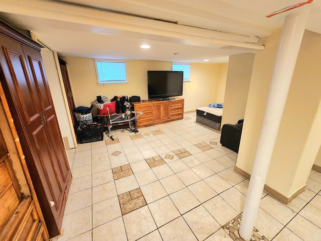 living room featuring light tile patterned floors and a wealth of natural light