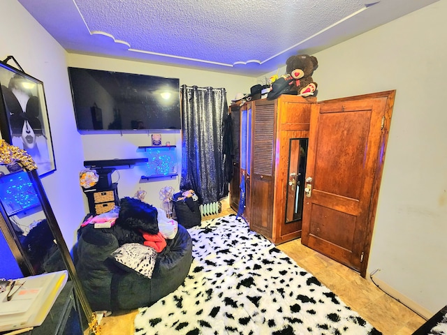 bedroom featuring a textured ceiling