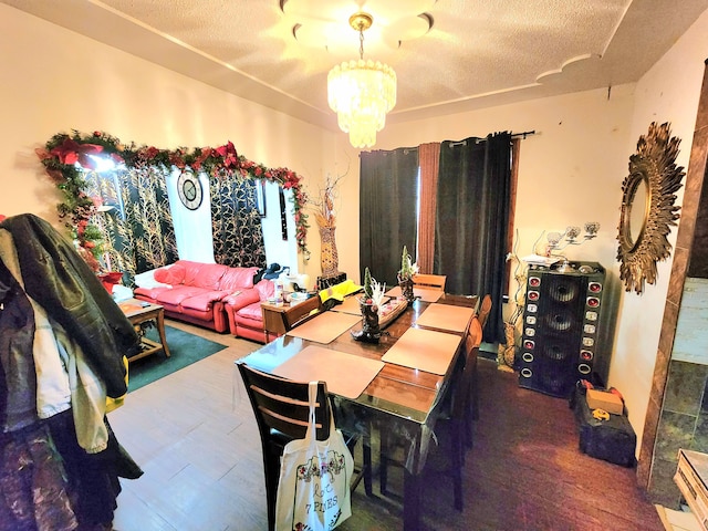 dining room featuring a notable chandelier and a textured ceiling