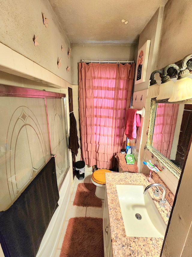 full bathroom featuring vanity, tile patterned floors, tub / shower combination, and toilet