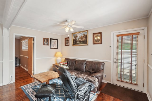 living room featuring ornamental molding, dark hardwood / wood-style floors, and ceiling fan