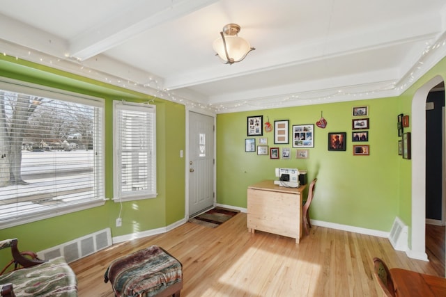 entrance foyer with beam ceiling and light hardwood / wood-style flooring