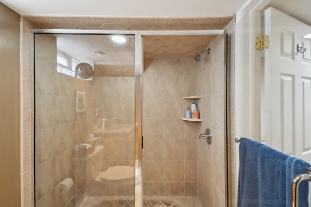 bathroom with an enclosed shower and toilet