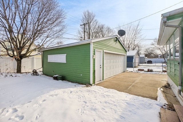 view of snow covered garage