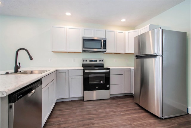 kitchen featuring sink, white cabinets, and appliances with stainless steel finishes