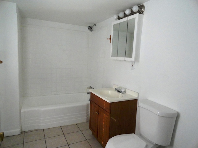 full bathroom featuring tiled shower / bath, vanity, toilet, and tile patterned flooring