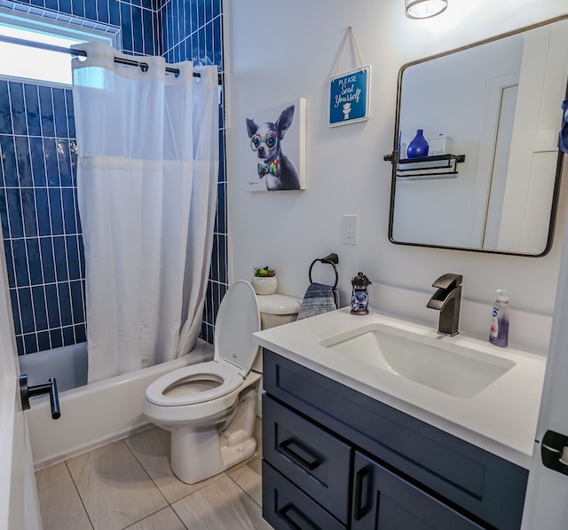 full bathroom with shower / tub combo, vanity, tile patterned floors, and toilet