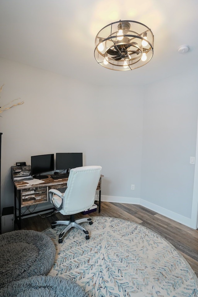 office featuring hardwood / wood-style flooring and a chandelier