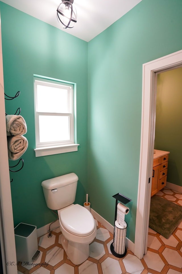 bathroom featuring vanity and toilet