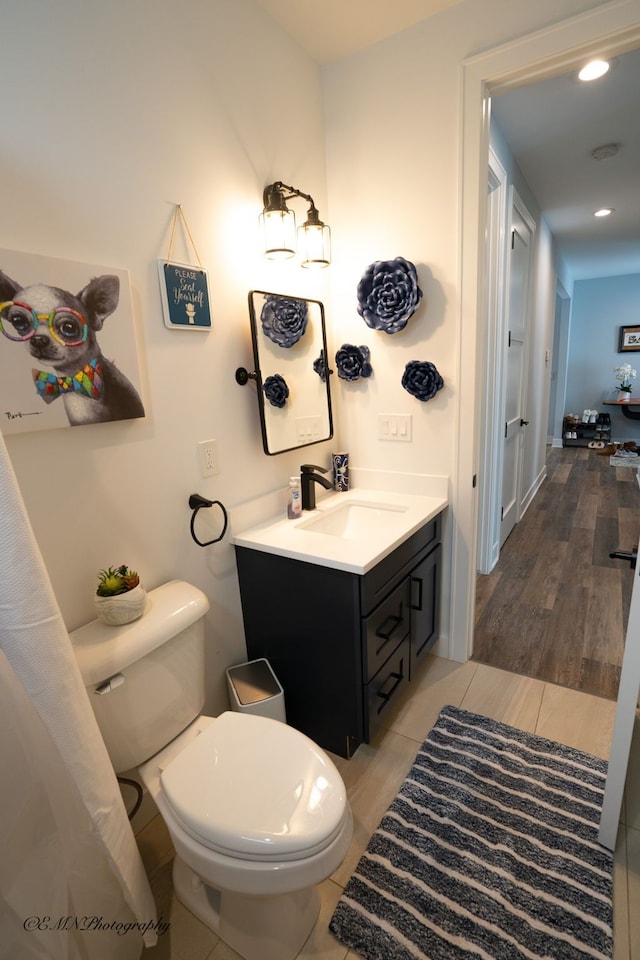 bathroom with vanity and toilet